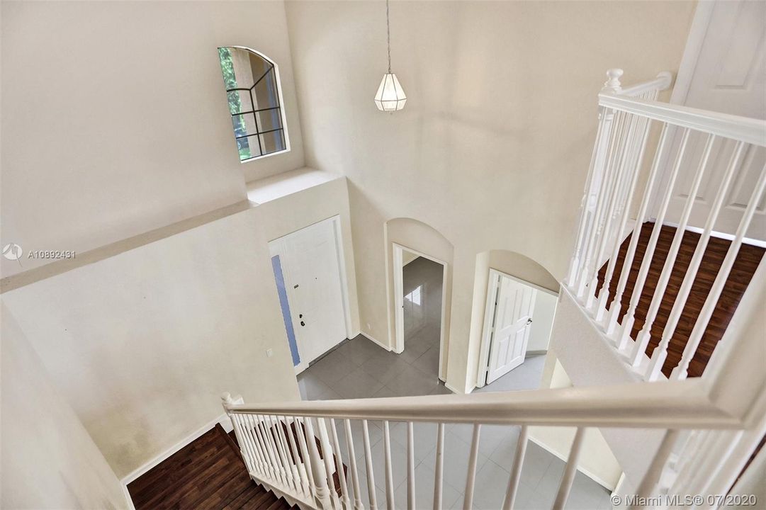 Staircase leading to large loft.
