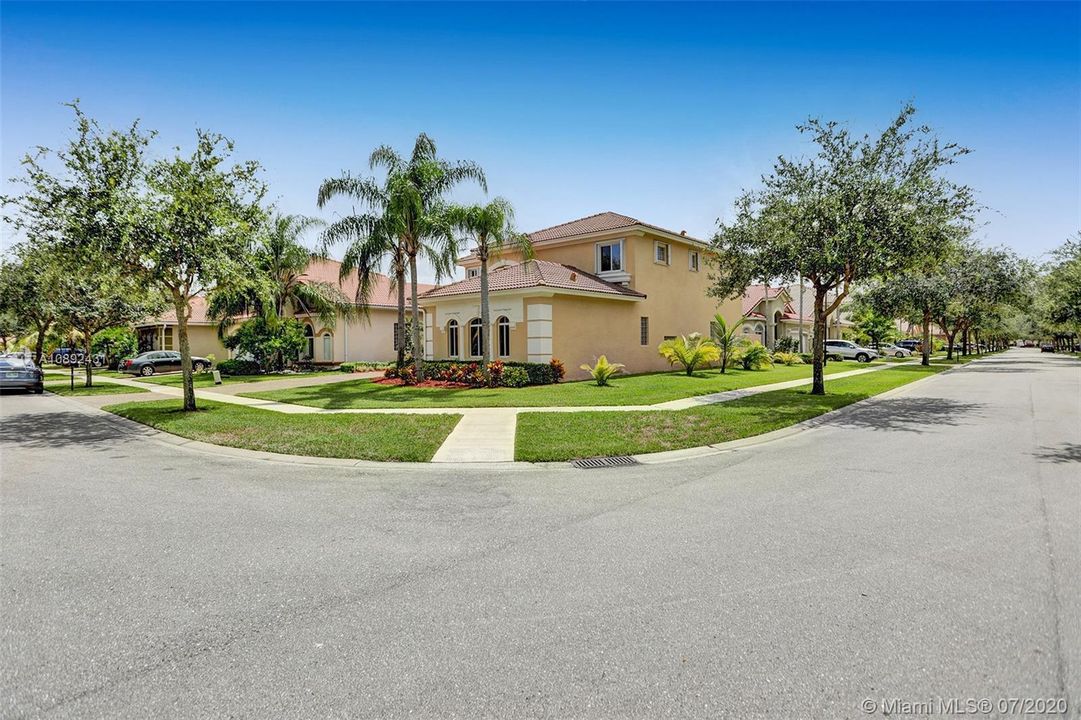 Home sitting on large corner lot.