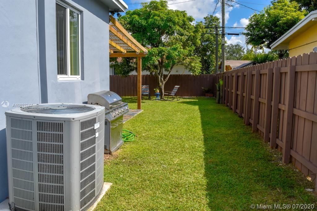 AN EXTRA BONUS IS A LARGE SIDE YARD