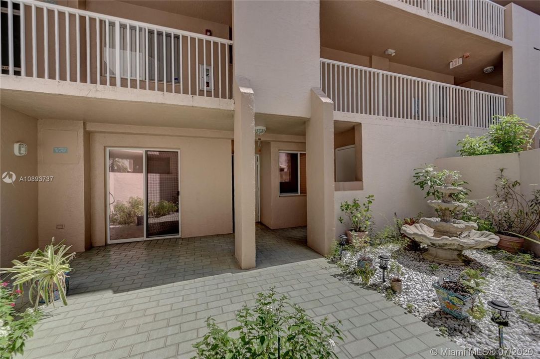 Front entrance with private patio and working fountain