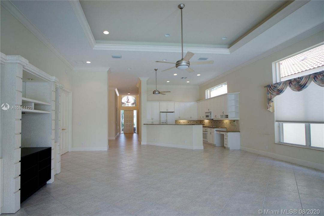 Open concept kitchen with views to living room/pool/patio/golf course