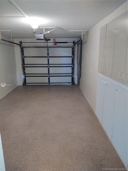 Garage has epoxy floor and extra storage cabinets. Perfect for car, truck. boat, kayaks, canoes, or all your extra belongings. Storage cabinets are very nice and clean inside. There is also a pull down in garage.