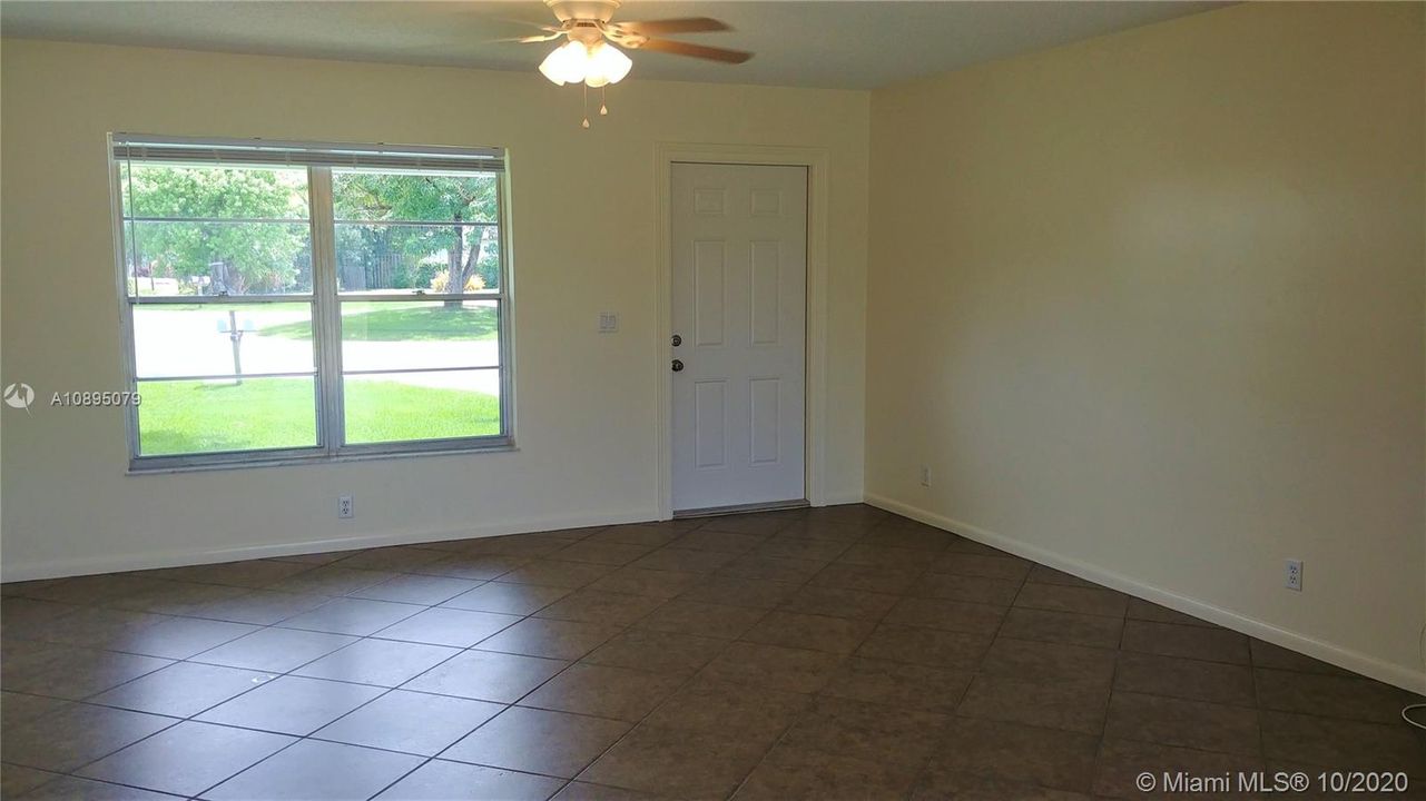 Nice size living room  Blinds at all windows. Plenty of light. Duplex is clean and ready for you.