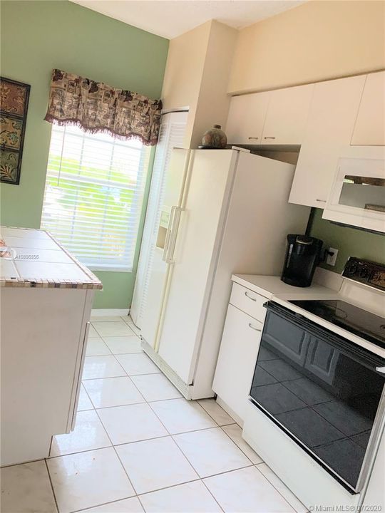 Kitchen with extra cabinet and counter top area