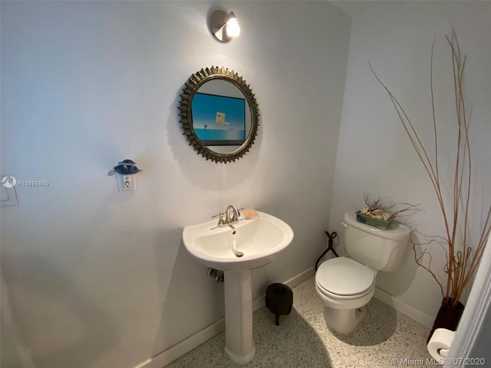 GUEST HALF BATH LOCATED OFF LAUNDRY ROOM AREA