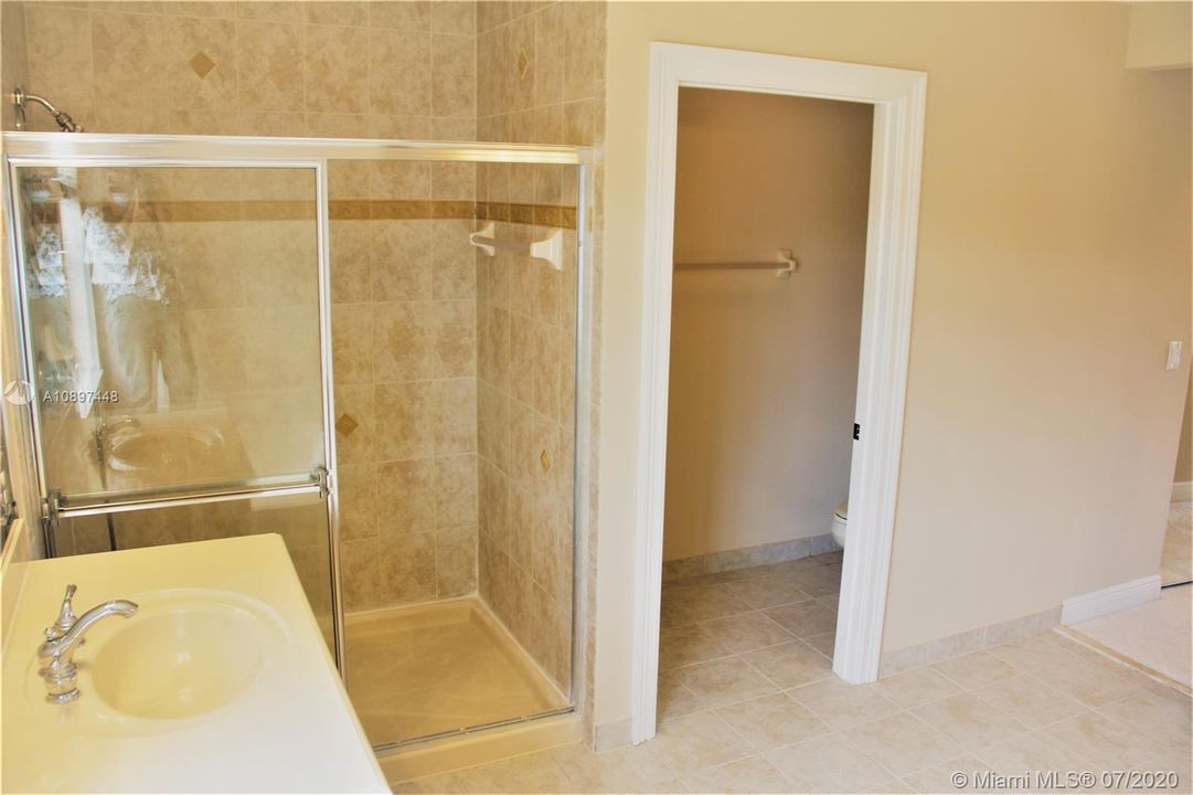 39 Master Shower, his sink & Toilet room