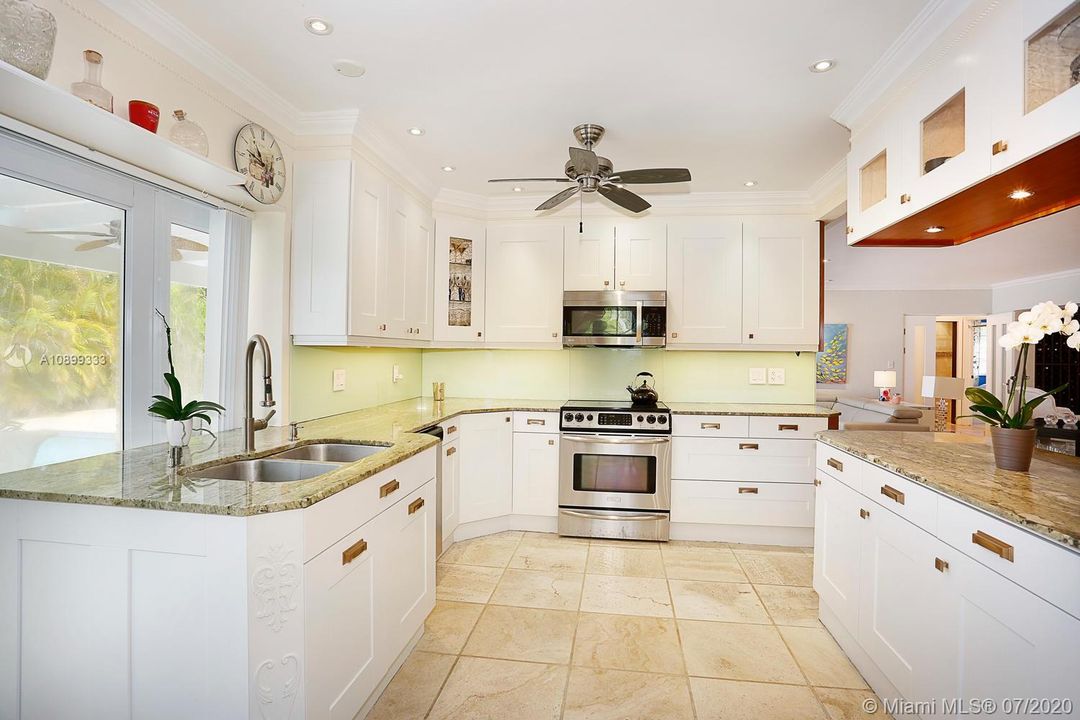 A wonderful kitchen, Doors open up to the pool area.