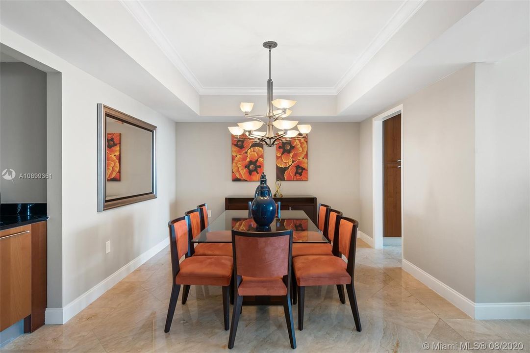 Formal dining room with crown molding