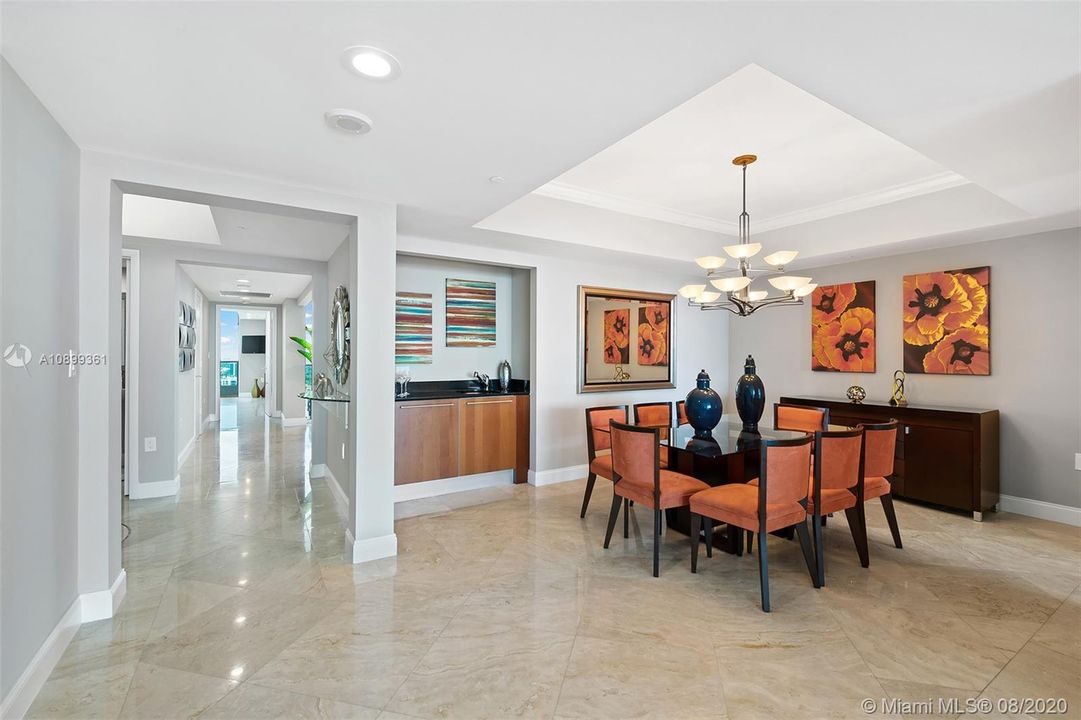 Open floorplan with formal dining room and wet bar, excellent for entertaining.