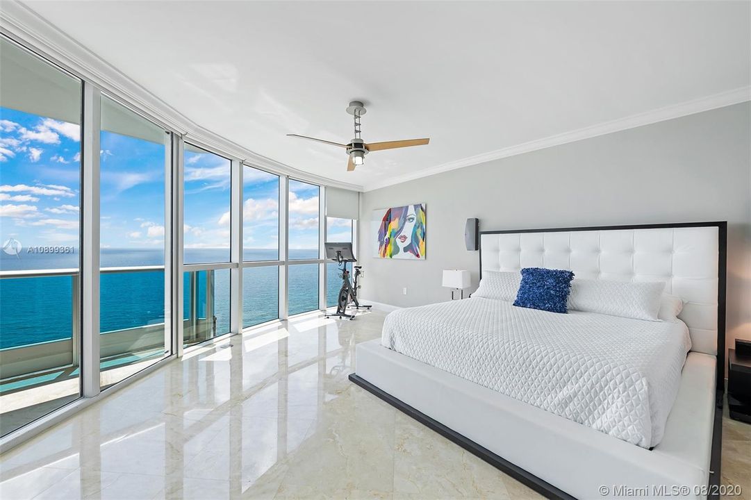 Stunning 18 by 18 master suite with floor to glass windows, surround sound, and electronic shades.  Direct ocean views all day!