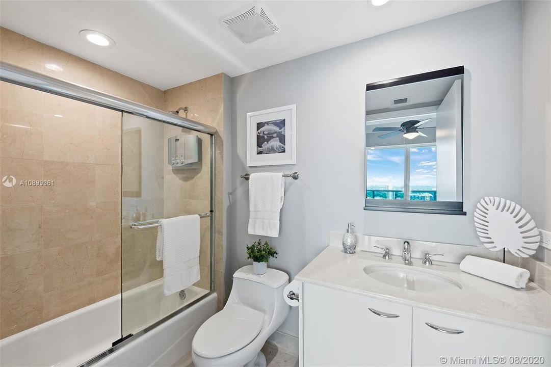 Guest bathroom tub/ shower combination & built in closets.
