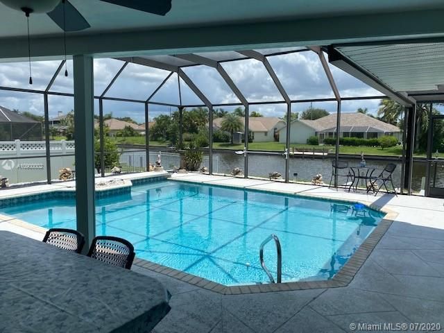 Screened In Patio and Solar Heated Pool (20x20) with view to canal.