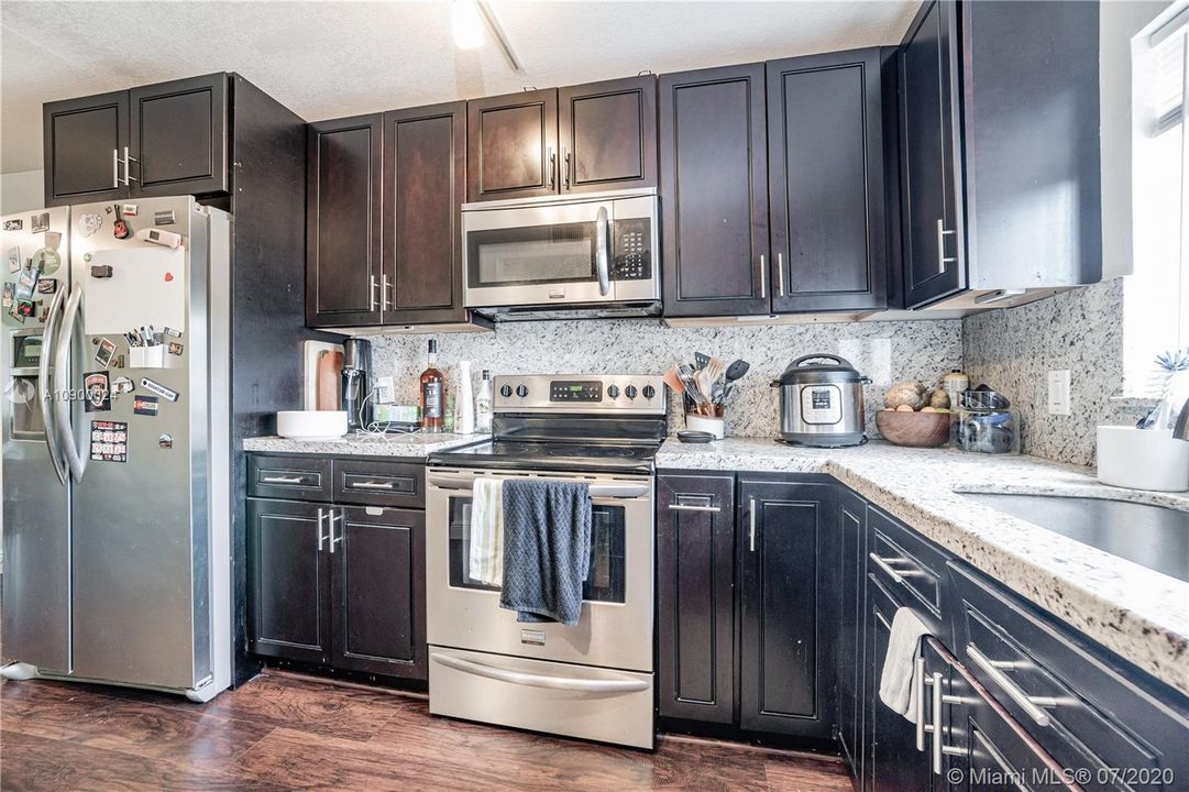 Espresso wood color cabinets.