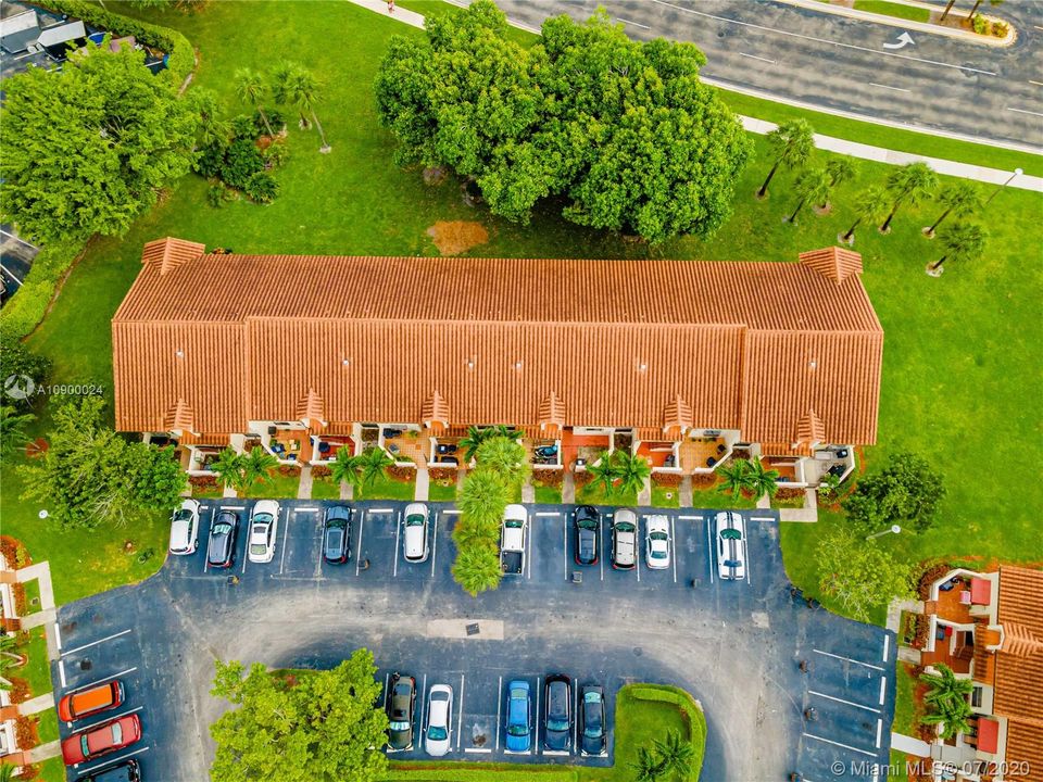 Ariel view of townhomes with parking and guest parking in the middle.