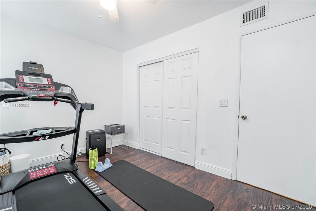 Second bedroom with closet and window.