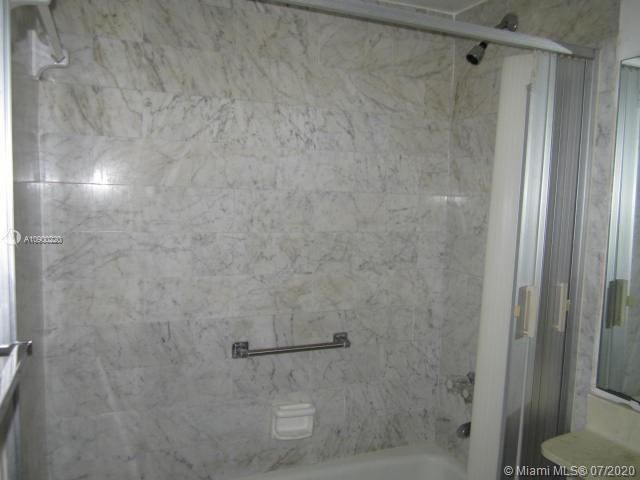 2ND BATHROOM-TUB WITH MARBLE TILE