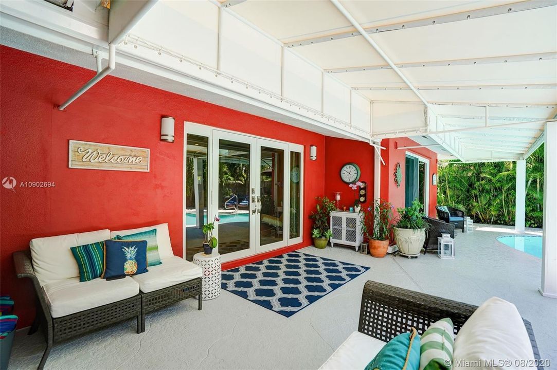 Covered patio next to pool