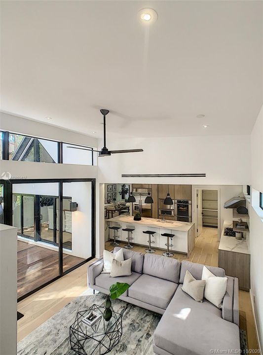 VIEW FROM STAIRWAY- FAMILY & KITCHEN