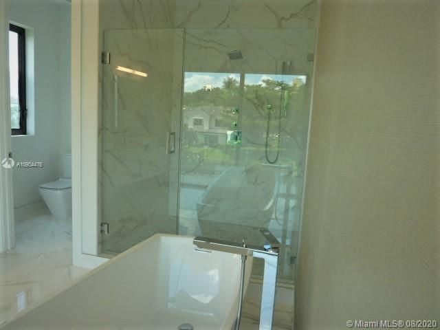 UPGRADES: FRAMELESS SHOWER DOOR AND HANHELD SHOWER SYSTEM