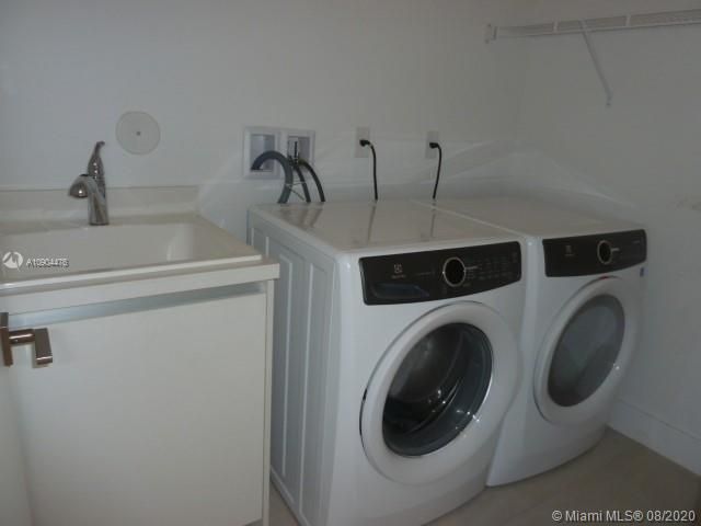 UTILITY ROOM WITH TUB AND UPGRADES CABINET