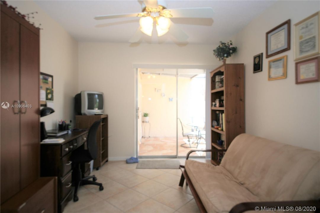Bedroom 2 with sliding door to screened in patio