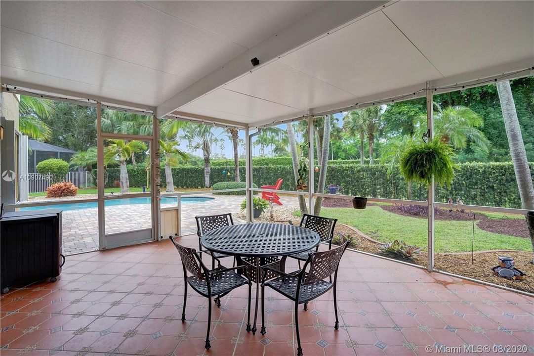 Screened in Patio overlooking pool and yard