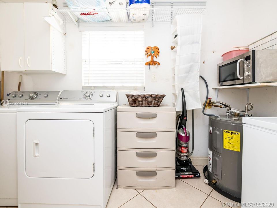 Large Laundry/Utility Room. Water Heater a few years old.