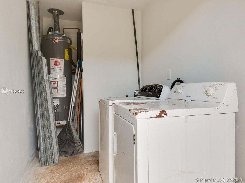 11650 Laundry Room with new water heater and storm panels