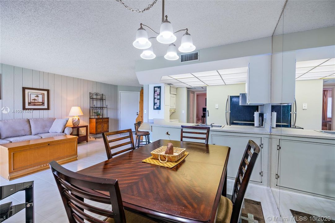 Open concept living room/ dining area/ kitchen.