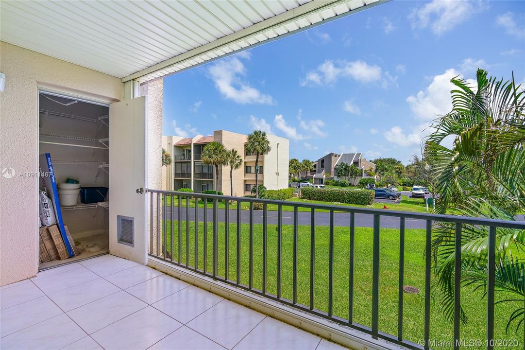 Outdoor balcony/porch area with storage closet. Seller to leave tile flooring for Buyer to install in bedroom. Accordion hurricane shutters.