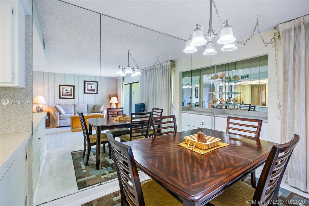 Dining area with refinished bar/storage area.
