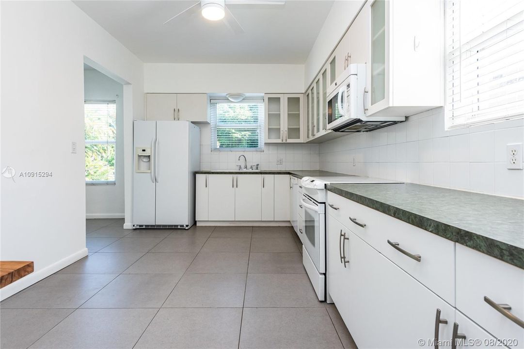 Spacious eat-in kitchen with lots of storage and cabinetry and extra space to cook