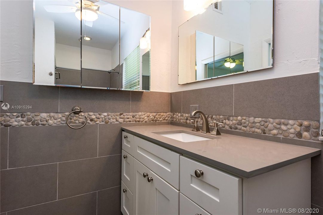 Master bathroom en suite with master bedroom and large vanity - lots of storage