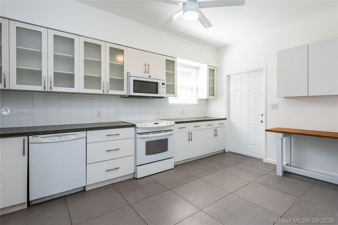 Oversized eat-in modern white kitchen 16' long with lots of storage and nice appliances