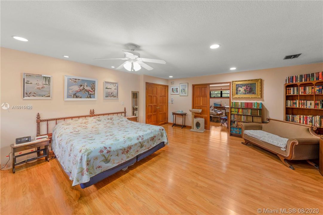 MASTER BEDROOM WITH FRENCH DOORS LEADING TO THE ADJACENT SITTING ROOM