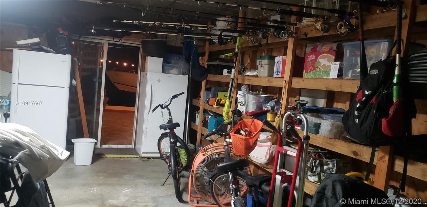 AMPLE GARAGE STORAGE. ALSO HAS AUTOMATIC GARAGE DOOR OPENER