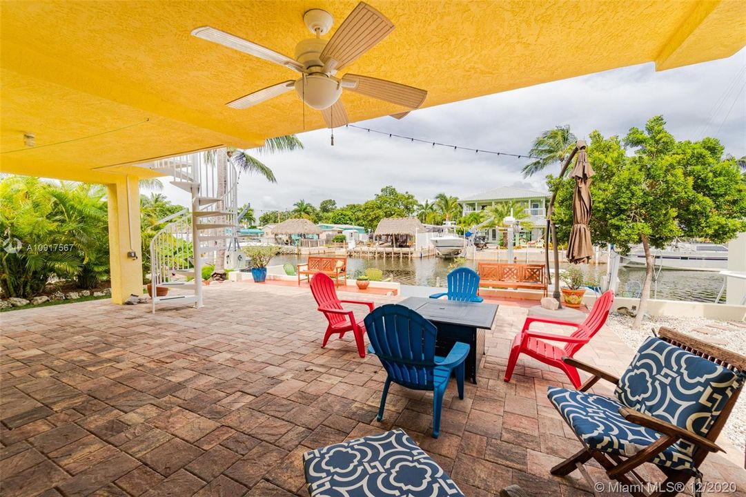 Covered area with paver brick patio and view of the waterway! Excellent for entertaining or just relaxing.