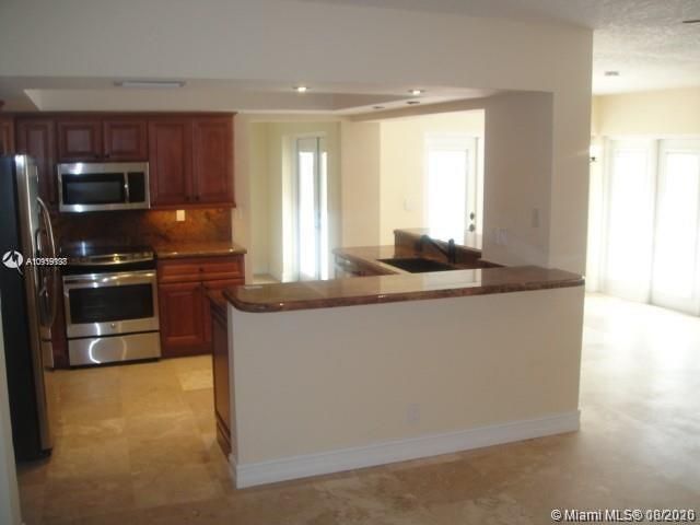 KITCHEN VIEW FROM FAMILY ROOM