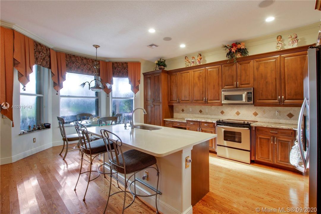 SPACIOUS KITCHEN ISLAND WITH NEW QUARTZ COUNTERTOP