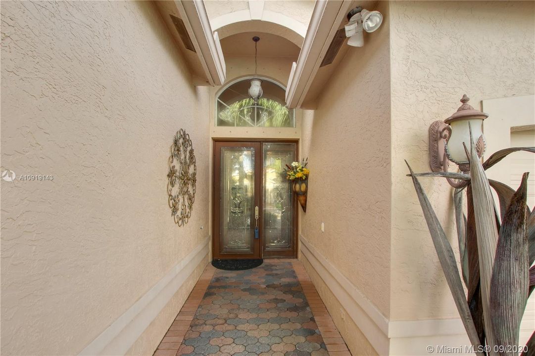 CUSTOM ETCHED GLASS WOOD DOORS AND ENTRY WAY STEP WAS REMOVED FROM DOORWAY