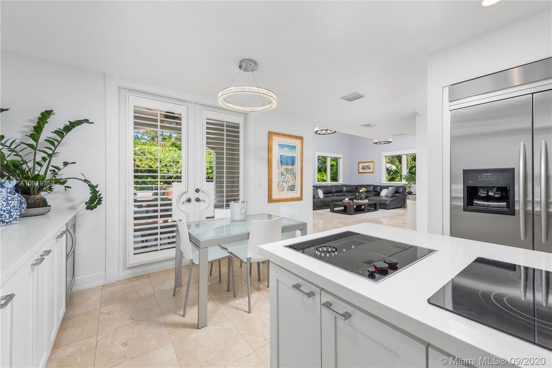 KITCHEN OPEN TO AN IMPRESSIVE  FAMILY ROOM
