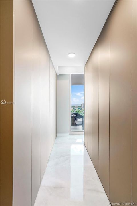 Floor-to Ceiling Fully Finished Italian Closets with Natural Light.