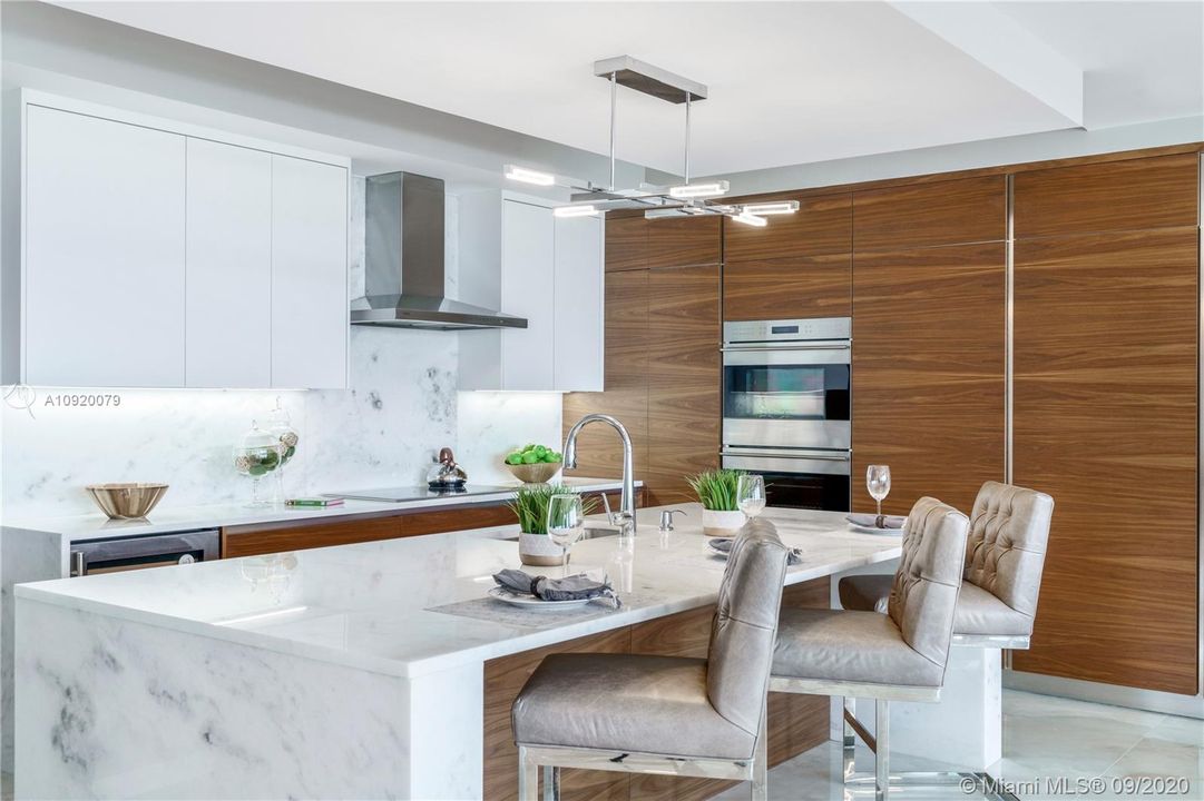 Chef's Kitchen with Wolf & Sub-Zero Appliances.  Full Fridge & Freezer, Dual Wall Ovens, Wine Cooler & Induction Cook-top.  Italian Cabinetry & Marble Countertops/Backsplash.
