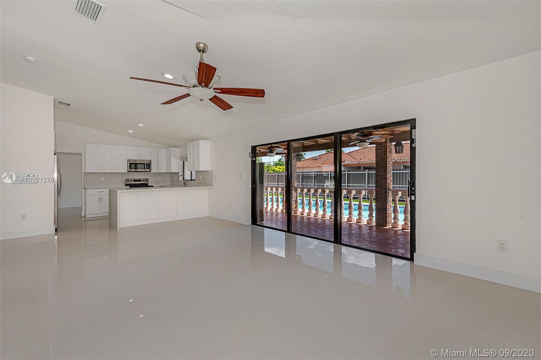 Large family room - relaxing views of the pool.