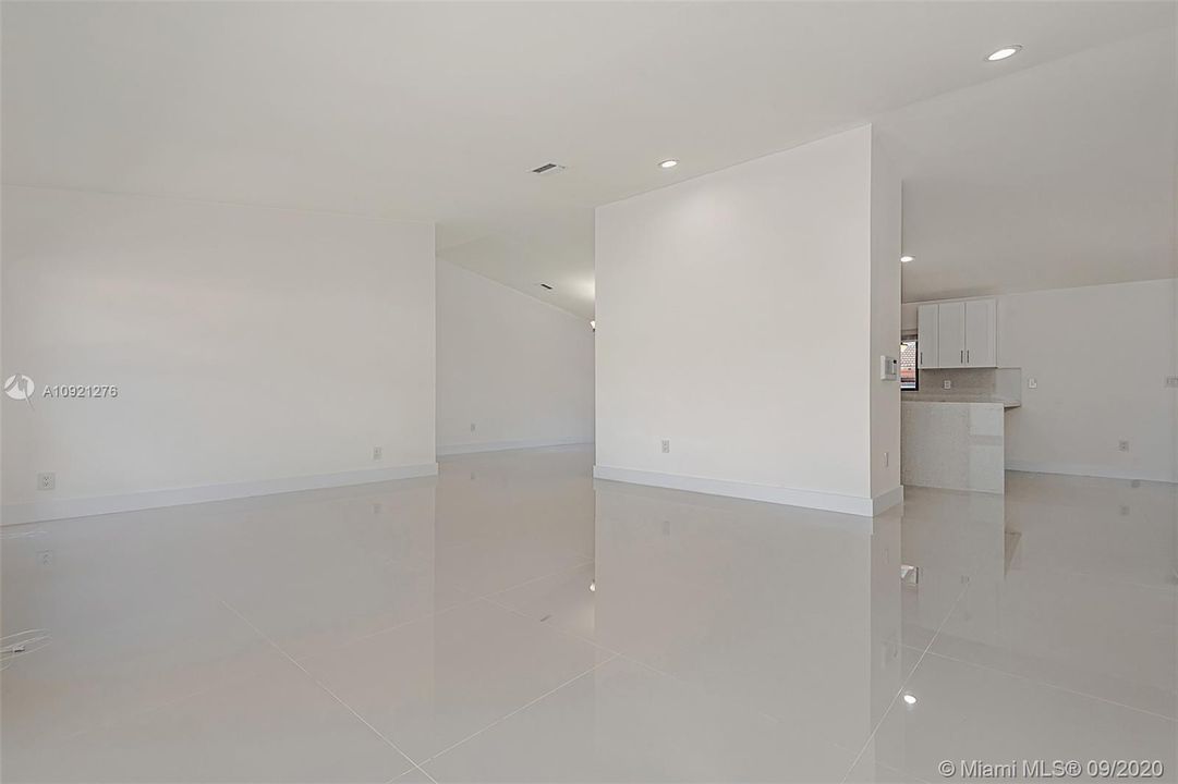 Home features XL ceramic tile...high volume ceilings...recessed lighting...freshly painted!