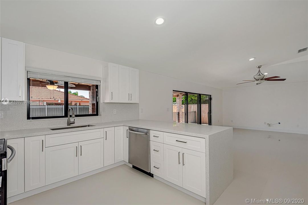 Kitchen offers a bay window with views to the backyard and covered patio area.