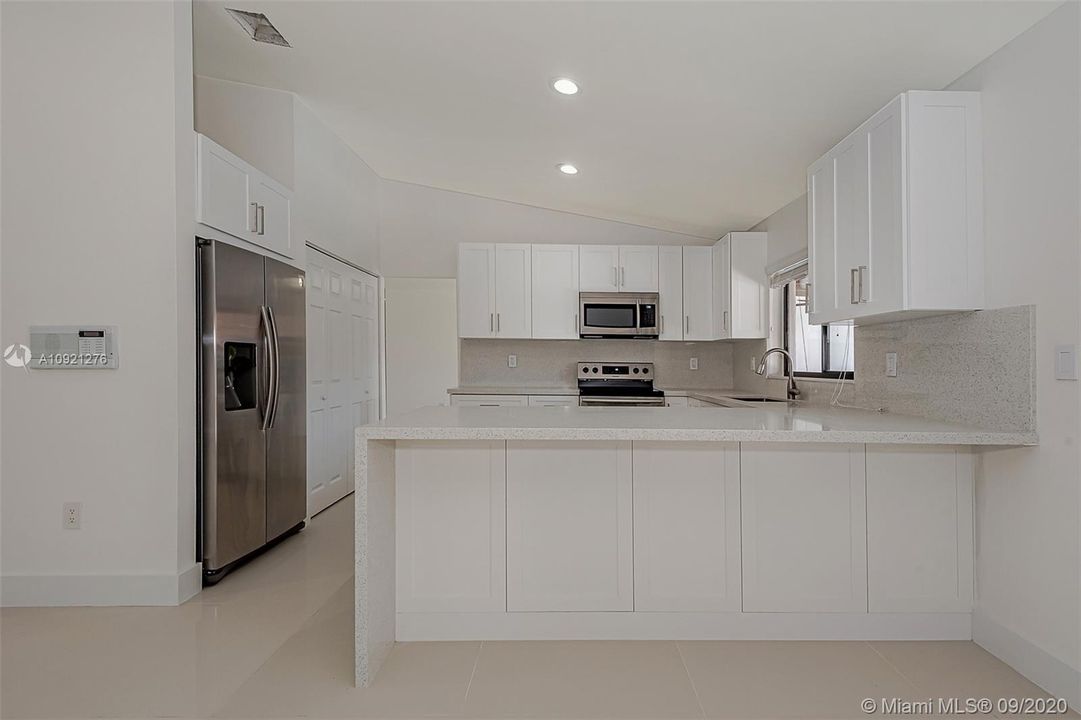 Brand new chef's kitchen - stainless steel appliances, granite counter-tops. custom backsplash, pantry!