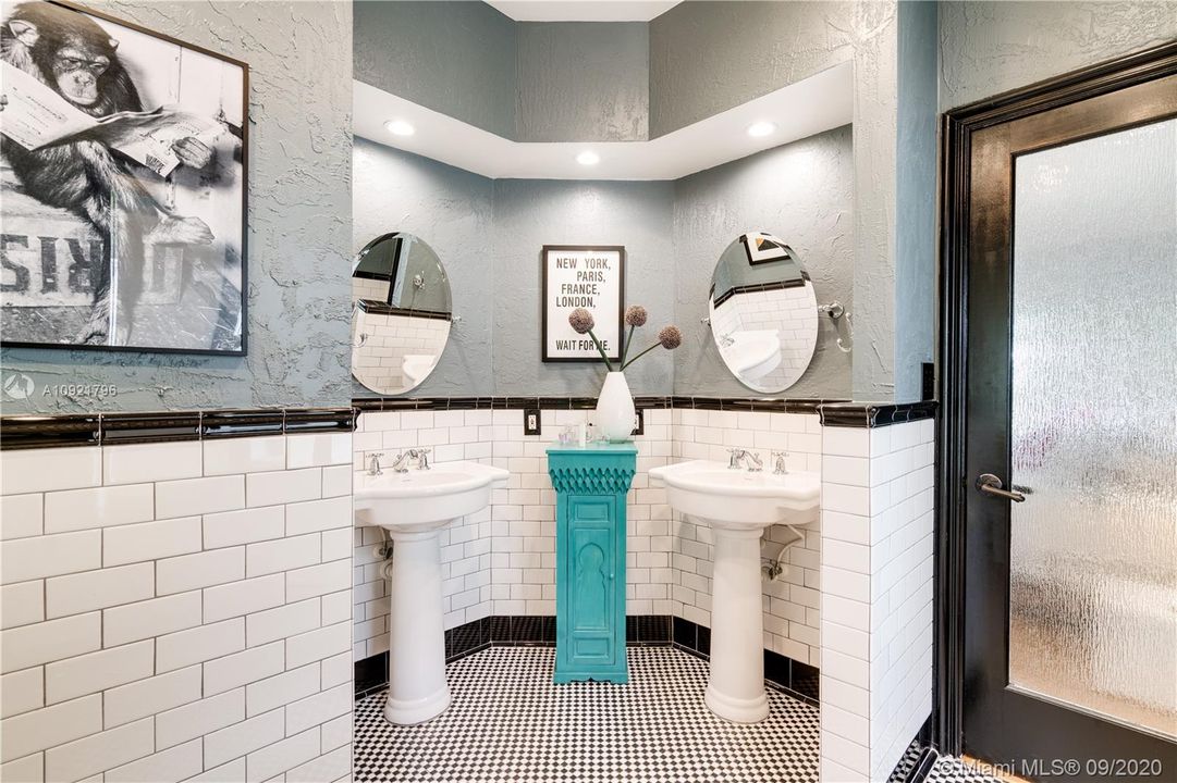 Primary bathroom with double sinks and shower and tub.