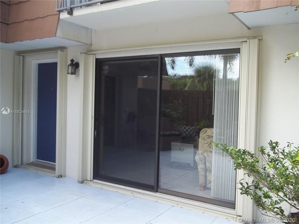 Accordion Shutters on 4 sliders & front door