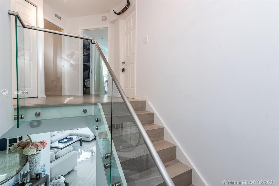 CONTEMPORARY GLASS RAILINGS AND OAK WOOD STAIRCASE